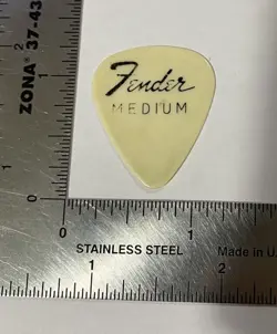 (1) FENDER MEDIUM WHITE GUITAR PICK FROM CAMERON COLLECTION