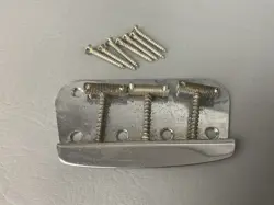 1960’S FENDER DUO-SONIC MUSICMASTER BRIDGE SET WITH SADDLES + MOUNTING SCREWS