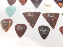 VINTAGE FENDER GUITAR PICKS LOT OF 23