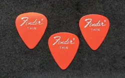3 VINTAGE 1970S FENDER GUITAR PICKS - RED / ORANGE - THIN GAUGE PICKS 351 SHAPE