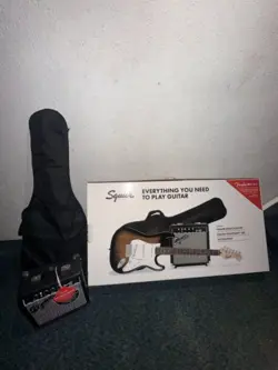 Squire By Fender Electric Guitar I Have Only Used It Twice Its Still Brand New!!