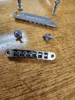 TAILPIECE AND STUDS