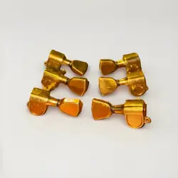 VINTAGE GIBSON EMBOSSED LOGO GOLD TUNERS