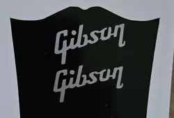 2 SILVER SMALL HEADSTOCK GIBSON LOGOS, DIE-CUT VINYL DECAL, 1.25 INCHES WIDE