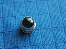 FACETED GREEN GLASS