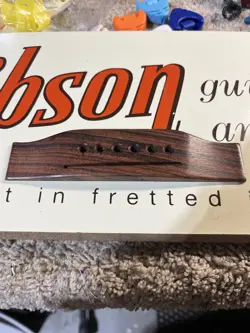 VINTAGE GIBSON ACOUSTIC BRIDGE