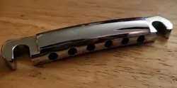 1980'S TAILPIECE CHROME