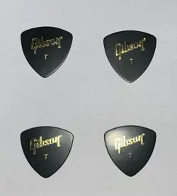 LOT OF 4 NEW GIBSON GUITAR WEDGE PICKS - THIN