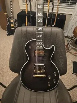 2023 GIBSON LES PAUL SUPREME - TRANSLUCENT EBONY 8LB 11OZ