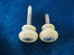 1960'S GIBSON WHITE PLASTIC STRAP BUTTONS FOR GUITAR