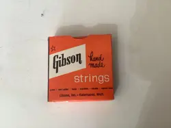 VINTAGE GIBSON MONA STEEL STRING BOX WITH STRINGS IN ORIGINAL PACKAGING