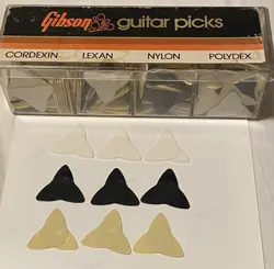 VINTAGE GIBSON PROPELLER GUITAR PICKS -1979- LOT OF 9- BLACK-CREAM & WHITE- NOS