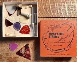 VINTAGE GUITAR PICKS AND PARTS IN A GIBSON STRING BOX
