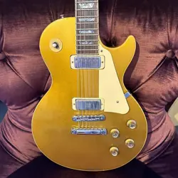 GIBSON 1976 LES PAUL DELUXE GOLD TOP ELECTRIC GUITAR W/ CASE (PRE-OWNED)