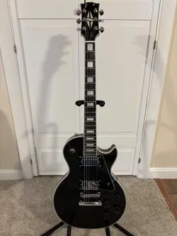 A RARE USED CUSTOM GUITAR W/GIBSON LES PAUL STRINGS IN VG CONDITION