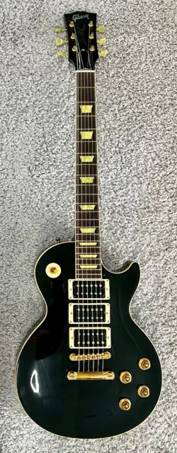 2003 GIBSON CLASSIC LES PAUL IN EBONY, 3 HUMBUCKERS, GOLD HARDWARE W/CASE - NICE