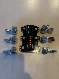 GIBSON G-FORCE TYPE A TRONICAL AUTO TUNING SYSTEM WITH CHROME KEYSTONE PEGS.