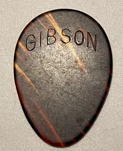VINTAGE GUITAR PICK-1930’S GIBSON 358 IMPRESSED ARCHED LOGO LARGETEARDROP-UNUSED