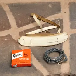 ~1960'S GIBSON GUITAR STRING BOX, OLD CABLE & AMACORD LEATHER STRAP