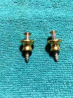 1960'S/70'S NOS GIBSON GOLD-PLATED ALUMINUM STRAP BUTTONS FROM KALAMAZOO FACTORY