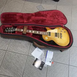 2017 GIBSON LES PAUL TRIBUTE ELECTRIC GUITAR IN A SATIN FADED HONEY BURST