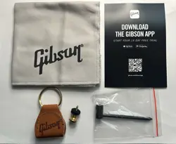 GIBSON ACOUSTIC CASE CANDY - WRENCH, CLOTH, GOLD STRAP PIN, LEATHER KEYCHAIN