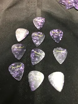 (10) UNUSED VINTAGE 1979S FENDER GUITAR PURPLE THIN PICKS