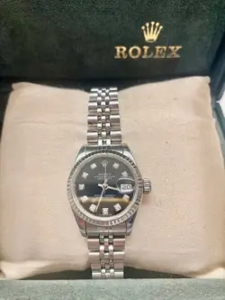 Ladies Rolex Oyster Datejust 26mm white gold bezel black face with diamond dial