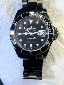 IS THIS A REAL ROLEX SUBMARINER 116610LN BLACK PVD ?