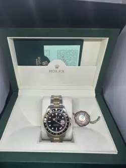 ROLEX GMT-MASTER II 16713 SILVER AND GOLD OYSTER BRACELET WITH BLACK BEZEL