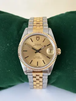 TUDOR OYSTERDATE 72033, 18K GOLD BEZEL, INCLUDING PAPERS AND ROLEX SERVICE.