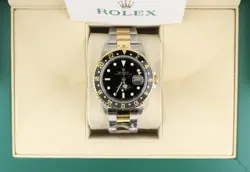 2006 ROLEX GMT-MASTER 16713 BLACK DIAL TT 18KT GOLD THRU OYSTER WITH PAPERS 40MM