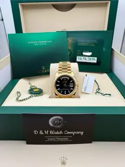 ROLEX 40MM DAY-DATE YELLOW GOLD-  ONYX WITH DIAMOND BAGUETTE DIAL - 228238