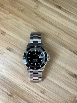 ROLEX SUBMARINER 16610LN SILVER OYSTER BRACELET WITH BLACK BEZEL