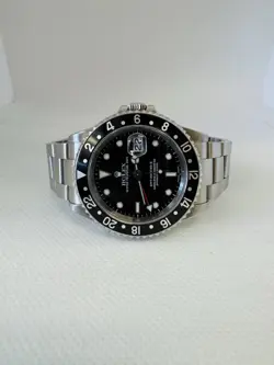 ROLEX GMT-MASTER II 40MM STAINLESS STEEL BLACK BEZEL DATE MODEL 16710