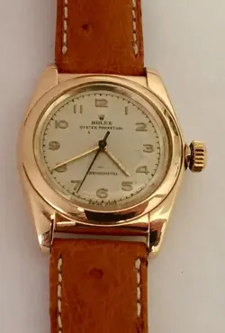 ROLEX BUBBLEBACK OYSTER PERPETUAL CHRONOMETRE: 14 K ROSE GOLD,18K BUCKLE,1950'S