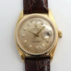 1970'S ROLEX 1803 DAY-DATE 36MM 18K YELLOW GOLD CHAMPAGNE DIAMOND DIAL WATCH