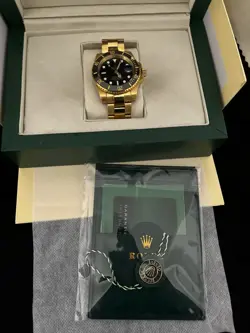 GOLD W/ BLACK FACE ROLEX