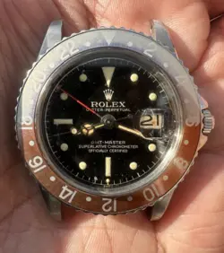 VINTAGE ROLEX GMT MASTER GHOST PEPSI 1675 BLACK GILT DIAL WATCH CIRCA 1960