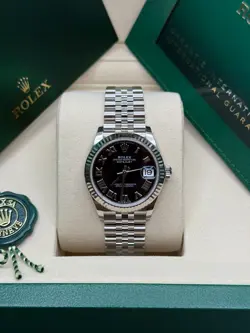 ROLEX DATEJUST 31 NEW 2025 BLACK ROMAN DIAL STAINLESS STEEL FLUTED BEZEL JUBILEE