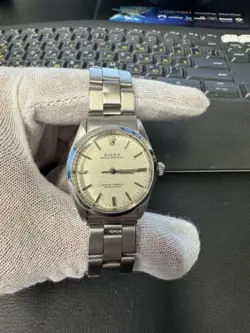 ROLEX STAINLESS STEEL OYSTER PERPETUAL 1002 34MM SILVER DIAL