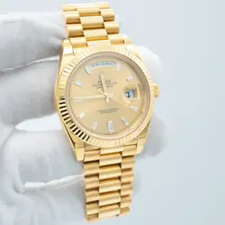 ROLEX DAY-DATE 40MM FACTORY CHAMPAGNE BAGUETTE DIAMOND WATCH 228238