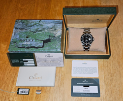 ROLEX SUBMARINER 16610 SILVER OYSTER BRACELET WITH BLACK BEZEL.