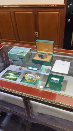 2004 ROLEX SUBMARINER MODEL 16610 WITH BOX, PAPERS, 2021 ROLEX SERVICE CARD