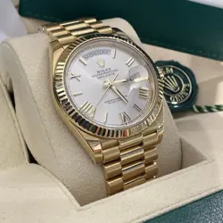 ROLEX DAY-DATE 40MM GOLD PRESIDENTIAL SILVER ROMAN DIAL FLUTED BEZEL REF: 228238