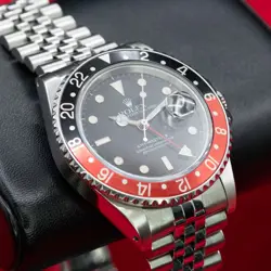 ROLEX R16760 GMT COKE, BLACK/RED BEZEL. COMPLETE SET/W/SERVICE RECORDS/ JUBILEE.