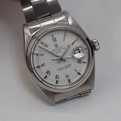 ROLEX DATE 34 MM STEEL WHITE ROMAN OYSTER AUTOMATIC WATCH 1500 CIRCA 1976