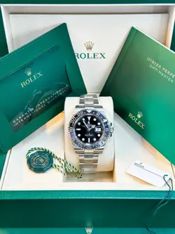 ROLEX OYSTERSTEEL GMT-MASTER II - BLACK AND GREY BEZEL - BLACK DIAL.
