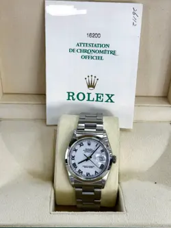 ROLEX DATEJUST 36 - STAINLESS STEEL - OYSTER - SMOOTH BEZEL - WHITE ROMAN DIAL.