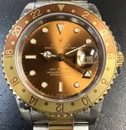 ROLEX GMT MASTER II 16713 18K YELLOW GOLD/STEEL 